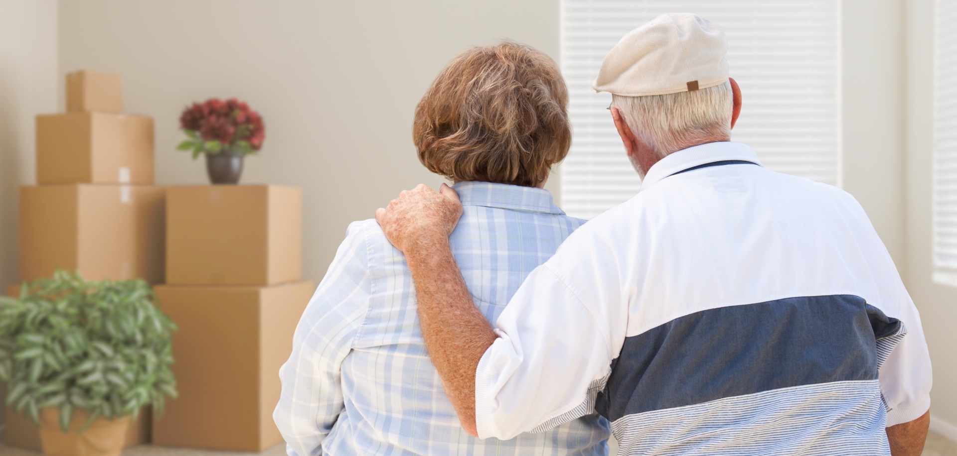 man and woman packing up their home