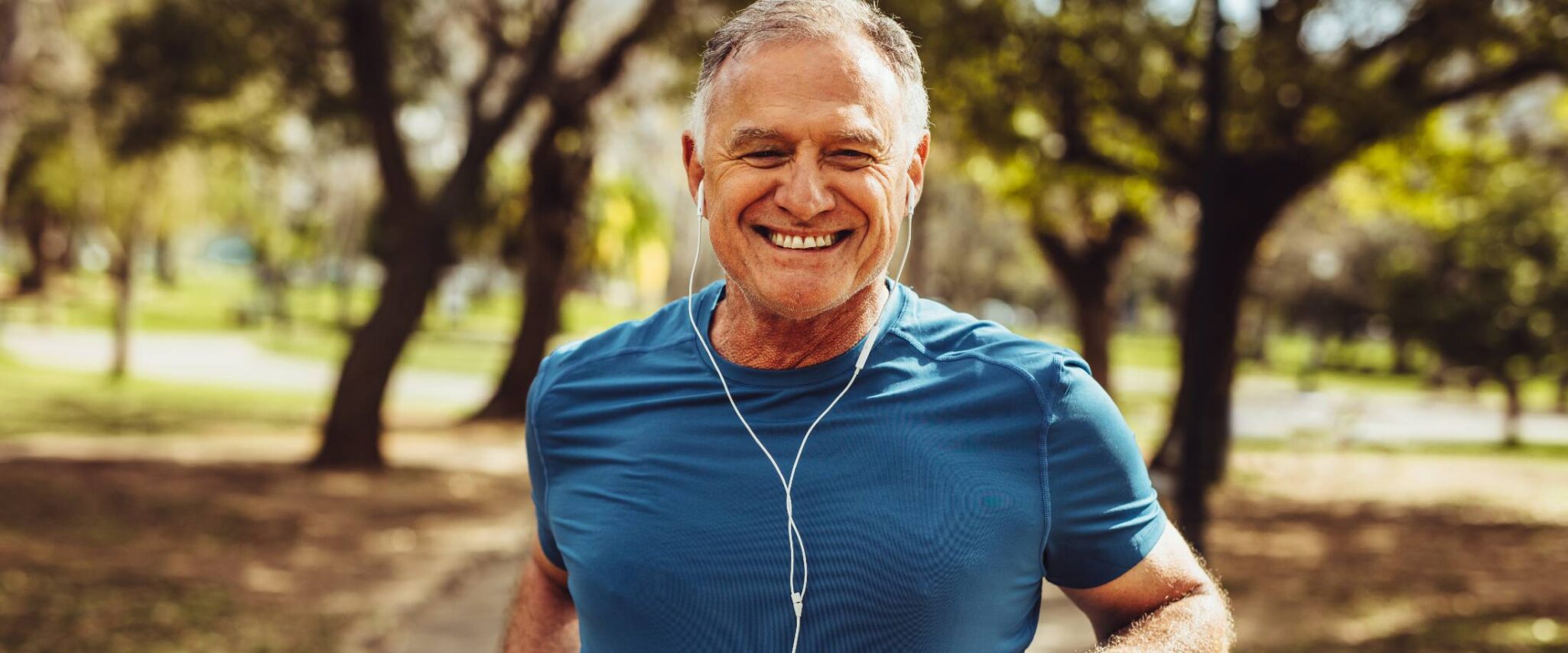 senior man jogging in a park