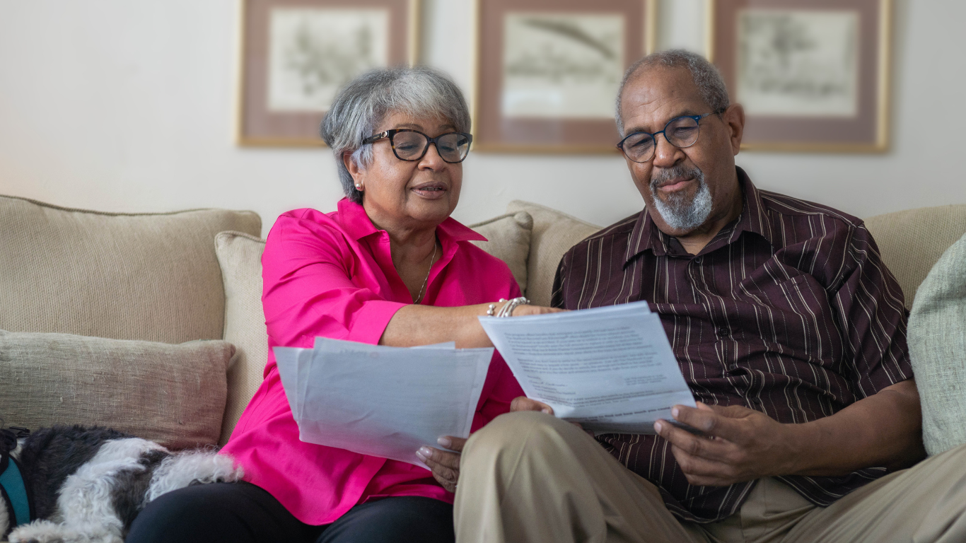 Senior couple looking over papers together