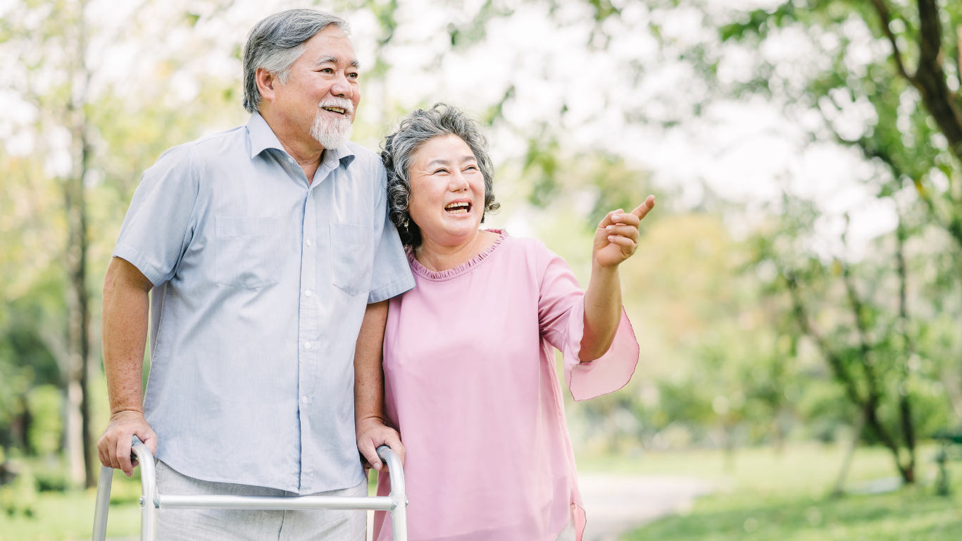 Smiling senior couple on outdoor walk