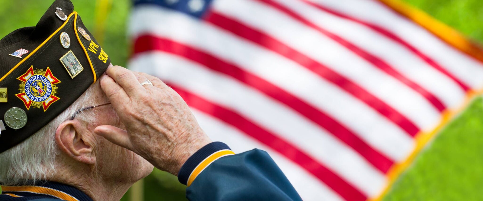 senior saluting the American flag for memorial dah