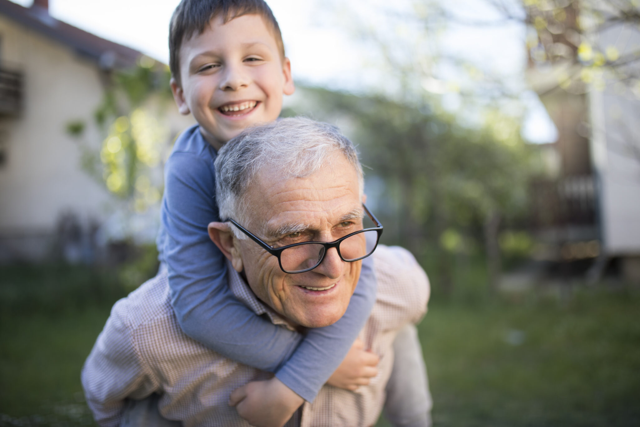 Little boy with his grandfather having fun outdoor