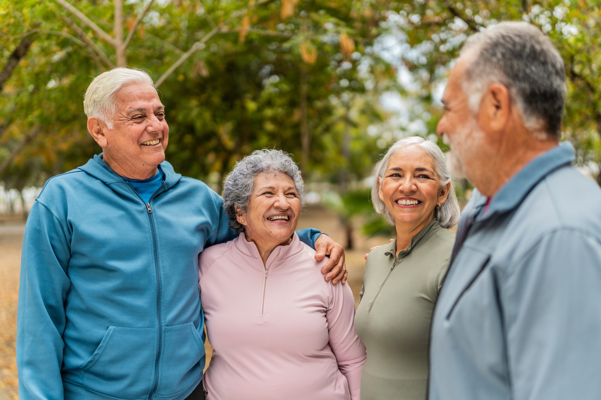 Group of senior friends smiling while outdoors